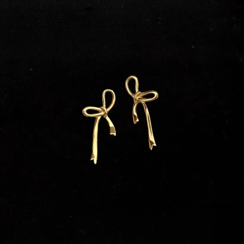 Gold bow tie earrings
